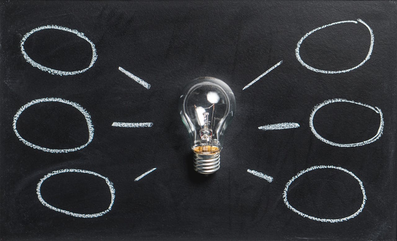 Services A lightbulb on a chalkboard symbolizes creativity, innovation, and ideas.